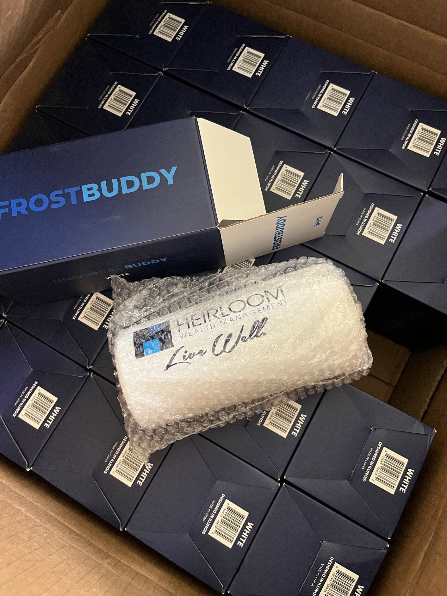 Case of custom-branded Frost Buddy tumblers packed for a corporate order
